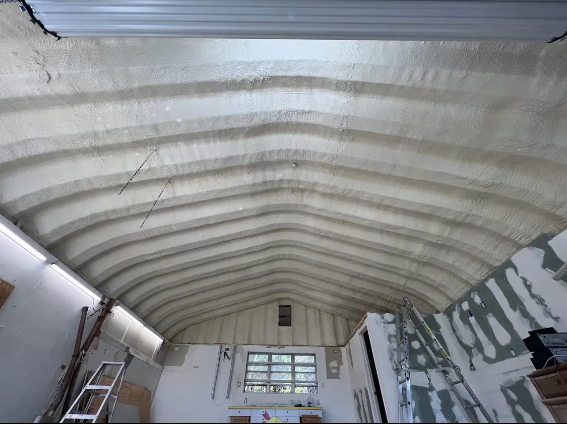 Spray polyurethane foam applied to the underside of a metal roof deck in Savannah